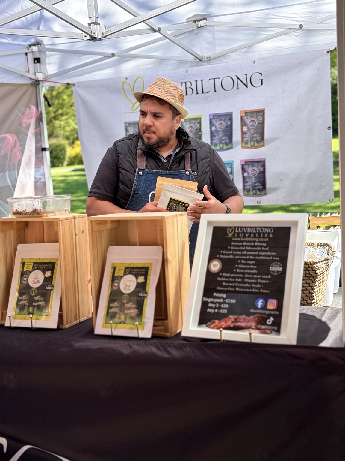 An independent biltong trader with his products at an outdoor market