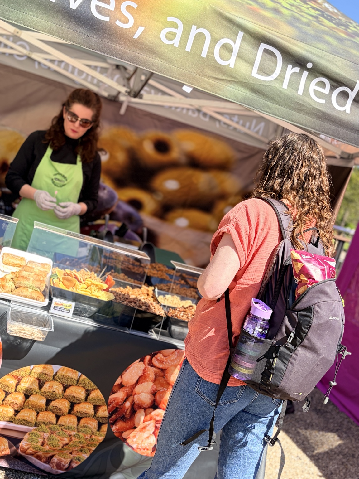 A visitor discovering food from an independent market trader