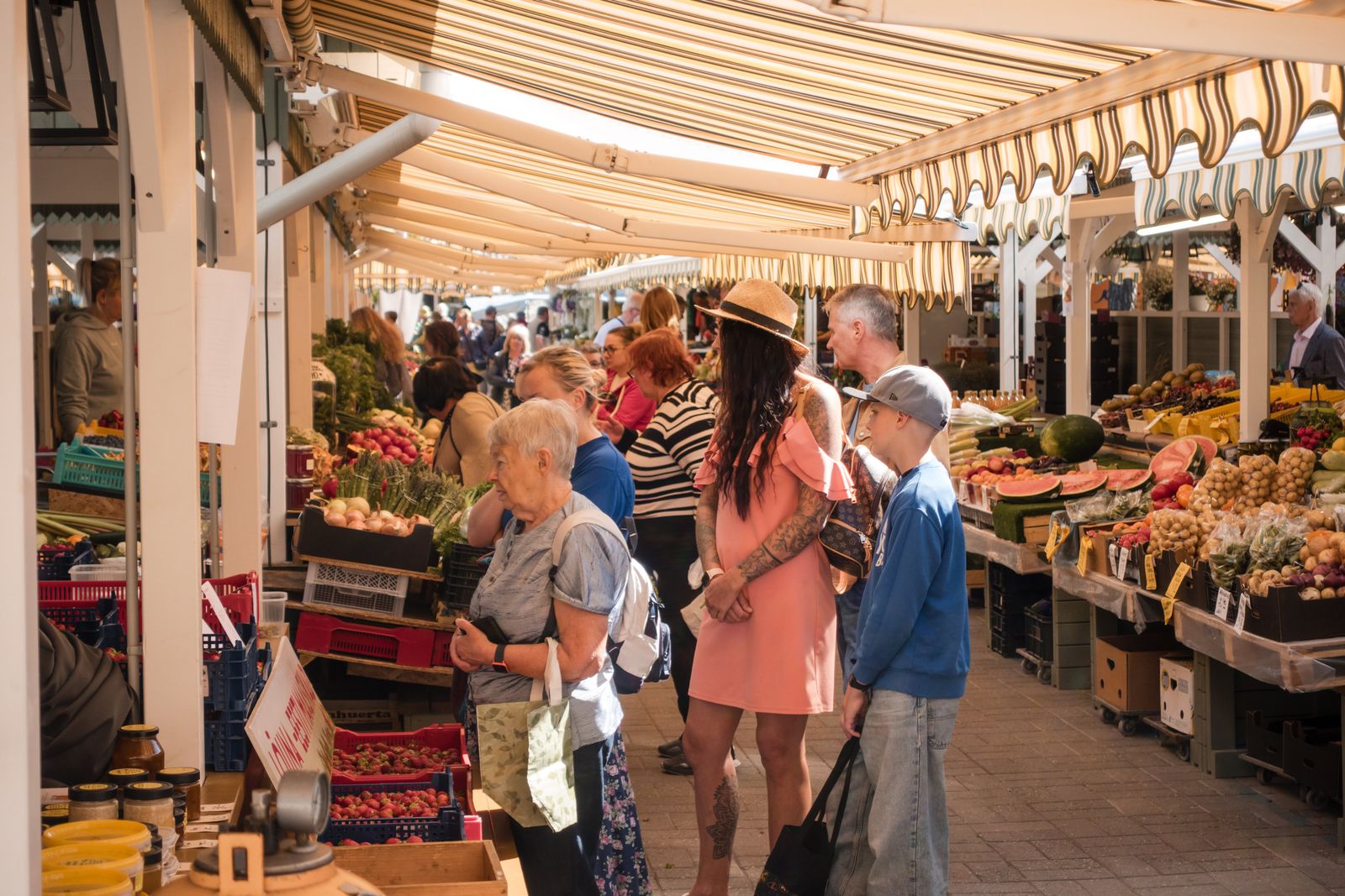 Shoppers exploring an outdoor produce market