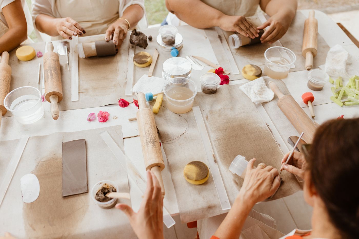 A group enjoying a hands-on pottery workshop